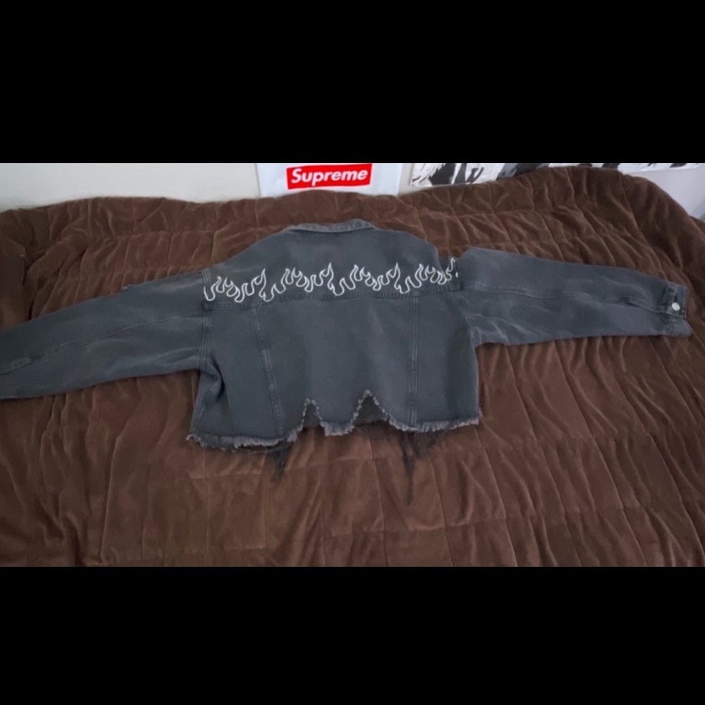 No brand. Jean jacket with embroidered flames on the back. It is a crop top